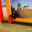 Ribbon Fitness II laste mänguväljakule iste ja ronimisstruktuur oranzis värvitoonis.