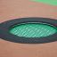 Round trampoline (100 cm) paigaldatud mänguväljaku värvilisele pinnale.