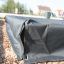 Sandbox cover 3m x 3m mustast kangast, paigaldatud liivakasti servale.