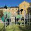 Fort with two towers and a slide laste mänguväljak metallist ja roheliste detailidega