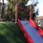 Laste liugpark Hill Slide Wide SLW210 punaste külgedega ja rohelise kattega.