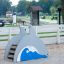Laste mänguväljak Dolphin Slide lainemotiiviga liivakastiga.
